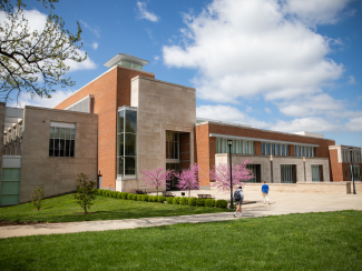 The rear entrance of the Gatton Business and Economics building during Spring.