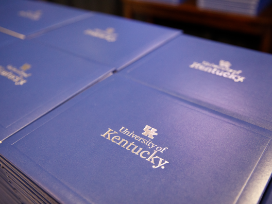 University of Kentucky diploma covers stacked neatly side by side.